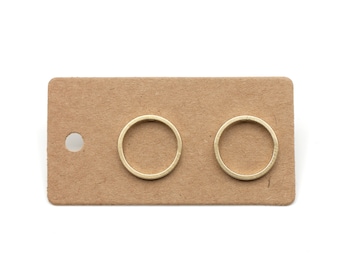 circular contour. 14mm hand-soldered ear studs in matt brass and stainless steel