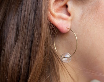 Bubble hoop earrings made from recycled brass with hollow glass beads. 35mm diameter