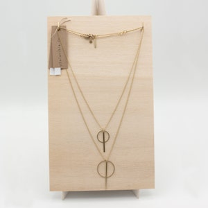 Oi. Bar and circle geometric brass necklace with a high recycled content image 7