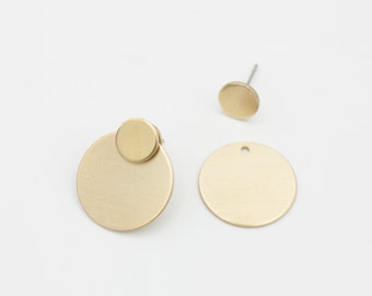 Circles. Round ear jackets in matt brass and stainless steel