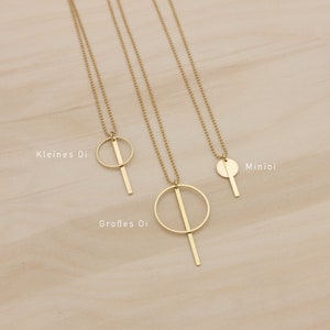 Oi. Bar and circle geometric brass necklace with a high recycled content image 2