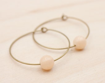 Dolomite. peach-coloured brass hoops with a diameter of 3.2 cm
