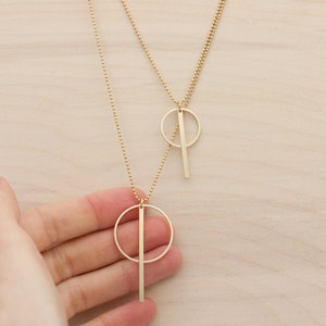 Oi. Bar and circle geometric brass necklace with a high recycled content image 4