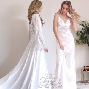 May include: Two white satin robes with lace detailing. One robe has long sleeves with lace trim and the other has spaghetti straps with lace trim on the bodice.
