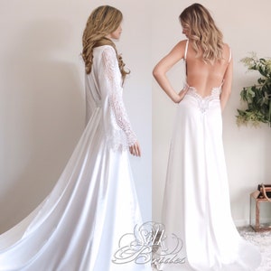 May include: Two white satin robes with lace detailing. One robe has long sleeves and a tie at the waist. The other robe has spaghetti straps and a low back.