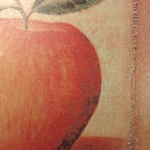 May include: A red apple with a green leaf on top, painted on a textured background.
