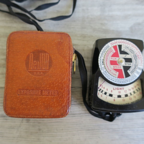 Vintage DeJur exposure meter or light meter with a leather case, antique photography accessories