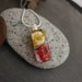PA H reviewed A beautiful Small red and yellow Floral mille fiori glass pendant.