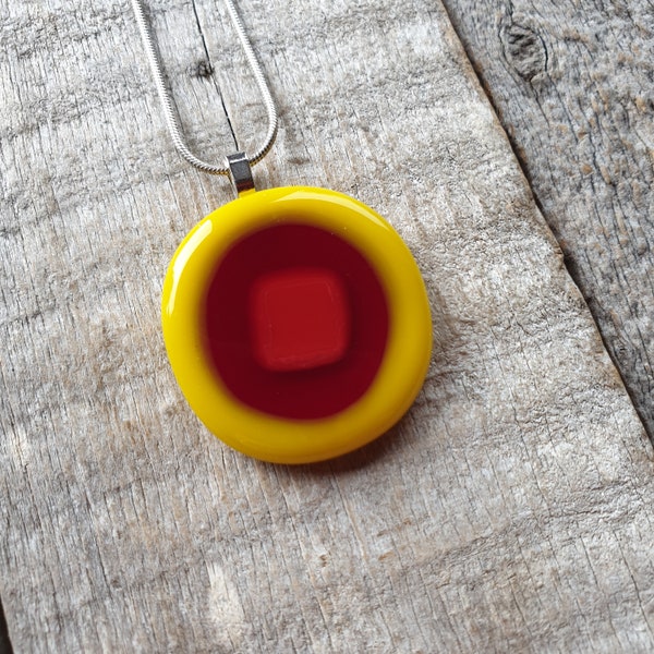 A beautiful bright yellow and red fused glass necklace. Stunning vibrant yellow and red compressed fused glass pendant.