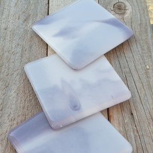 Amazing grey skies coasters, beautiful handcrafted lilac, white and lavender coloured fused glass coasters. Perfect for a cuppa to rest on.