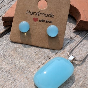 Stunning aqua blue fused glass necklace and earrings set. Beautiful ligh blue coloured glass jewellery. Stunning necklace and stud earrings.