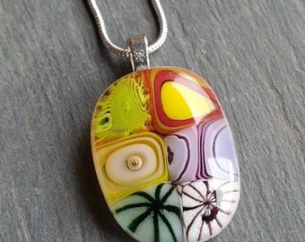 Amazing candy murrini glass necklace. Lovely colourful swirls and detail in these handcrafted fired glass pendants and jewellery