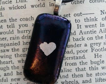 A unique black, blue and pebble effect fused glass necklace. Lovely compressed art glass pendant.