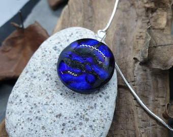 A sweet little blue dichroic glass circular pendant.