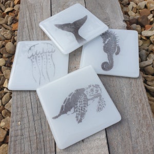 Beautiful sea animal coasters. Wonderful white fused glass coasters with jellyfish, turtle, seahorse, whale designs.