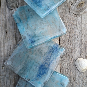 Wash of the sea coasters. Lovely handcrafted fused glass coasters with washes of bubbly blues and whites in.