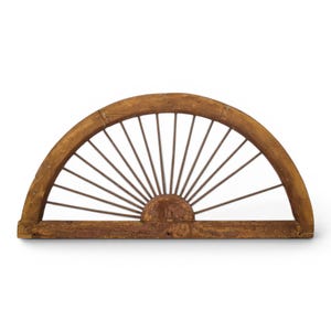 May include: A semi-circular wooden architectural element featuring a weathered brown finish and a series of thin, radiating metal spokes that extend from a central semi-circular base to the curved outer frame, creating a fan-like structure.