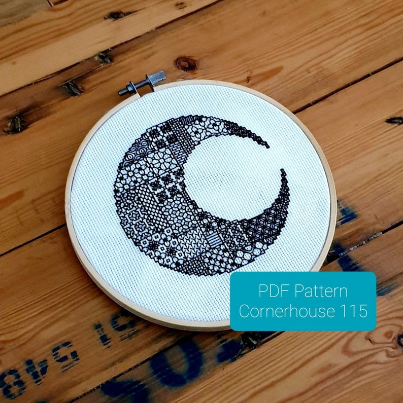 May include: A black and white crescent moon cross stitch pattern in a wooden embroidery hoop. The pattern is made up of different small geometric shapes. The text "PDF Pattern Cornerhouse 115" is visible in the bottom right corner of the image.