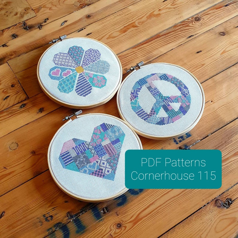 May include: Three embroidery hoop patterns featuring a peace sign, a heart, and a flower. The patterns are all in shades of blue, pink, and purple. The text "PDF Patterns Cornerhouse 115" is visible in the bottom right corner.
