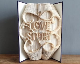 Vouwpatroon liefdesverhaalboek en handleiding voor beginners. Maak je eigen Valentijnsdagcadeau. DIY-bruiloftdecoratie. Handgemaakt cadeau-idee voor een jubileum