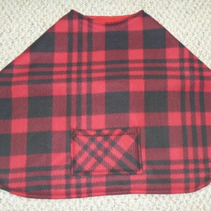 May include: Red and black plaid fleece poncho with a pocket.