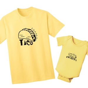 May include: A yellow t-shirt with a black cartoon taco and the word "Taco" printed on it. A yellow baby onesie with a black cartoon taco and the word "Taquito" printed on it.