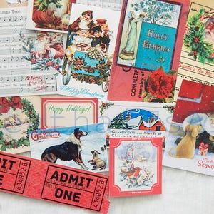 May include: A collection of vintage Christmas cards and paper ephemera featuring images of holly, wreaths, Santa Claus, and winter scenes. The cards are printed on various colored paper and feature a variety of fonts and illustrations. There are also two red paper tickets with the text "ADMIT ONE" printed on them.