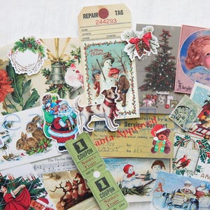 May include: Assortment of vintage Christmas themed paper ephemera, including postcards, tags, and stickers. The images feature a variety of holiday motifs, such as Santa Claus, reindeer, snowmen, and Christmas trees. Some of the ephemera have text, such as "A Happy Xmas" and "Santa's Train".
