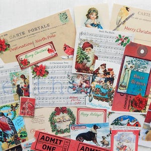 May include: A collection of vintage Christmas themed paper ephemera, including postcards, sheet music, and tags. The ephemera features images of Santa Claus, holly berries, and a Christmas tree. The text on the ephemera includes "Merry Christmas", "Deck the Halls", and "Holly Berries".
