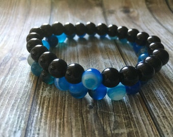 Natural lapis blue lines round beaded bracelets. Black stone bracelets & bangles