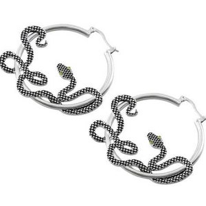 May include: Silver hoop earrings with a snake design. The snakes are black and have green eyes.