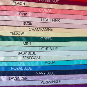 May include: A collection of 18 satin ribbon samples in various colours, including black, red, chocolate, burgundy, peach, coral, pink, light pink, rose, champagne, yellow, green, mint, light blue, baby blue, seafoam, aqua, royal blue, navy blue, lavender, periwinkle, purple, ivory, white, and grey.