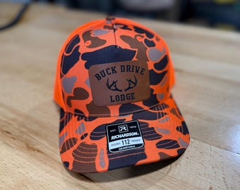 Customized Deer Camp Logo Leather Patch Trucker Cap - Blaze Orange Camo