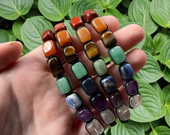 Verstelbare zwarte gevlochten armband met kristalchakrasteen