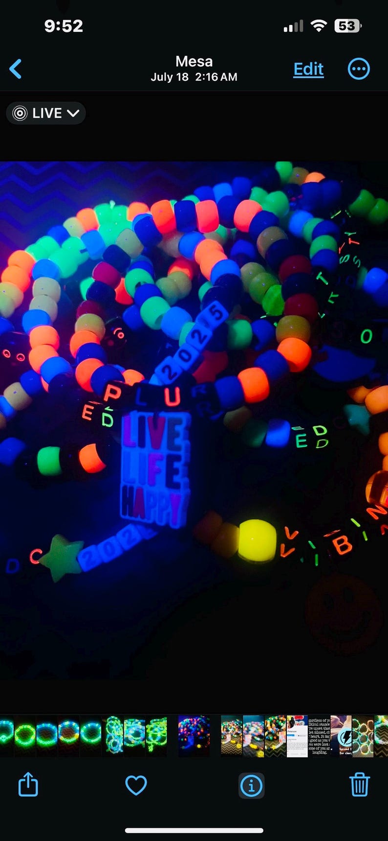 May include: A collection of colorful beaded bracelets and accessories, glowing under a black light. The bracelets feature neon orange, blue, green, and yellow beads. Some bracelets spell out words like "LIVE LIFE HAPPY" and "2025".