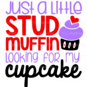 May include: A purple cupcake with a red heart on top and the text "Just a little stud muffin looking for my cupcake" in red and black.