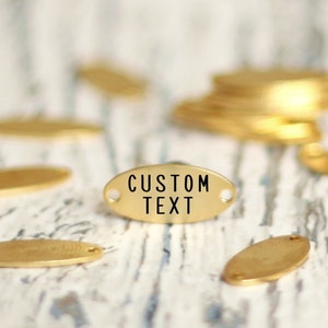 Wholesale labels engraved charms. Metal custom oval tags. Personalised text sticker. Steel golden image links. Jewelry charms customized bar