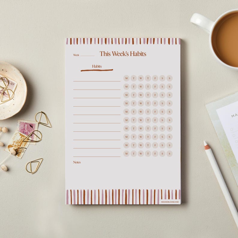 May include: A printable habit tracker with a brown and pink striped border. The tracker has a section for listing habits and a weekly calendar with circles for each day of the week.