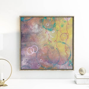 May include: Abstract painting with a yellow, brown, and purple background. The painting features pink and white circles and red lines.