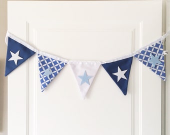 baby boy little stars fabric bunting banner, to decorate your nursery, blue and white pattern with the written baby boy or little stars