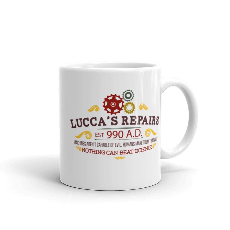 May include: White ceramic mug with the text "LUCCA'S REPAIRS" in a vintage style, featuring gears and the phrase "EST 990 A.D." and "NOTHING CAN BEAT SCIENCE". The mug has a curved handle.