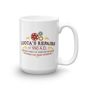 May include: White ceramic mug with the text "LUCCA'S REPAIRS EST 990 A.D." and the quote "MACHINES AREN'T CAPABLE OF EVIL. HUMANS MAKE THEM THAT WAY. NOTHING CAN BEAT SCIENCE." The mug features a handle and a design with gears.