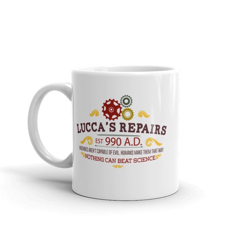 May include: White ceramic mug with the text "LUCCA'S REPAIRS EST 990 A.D." and the quote "MACHINES AREN'T CAPABLE OF EVIL. HUMANS MAKE THEM THAT WAY. NOTHING CAN BEAT SCIENCE." The design includes gears in red and green.