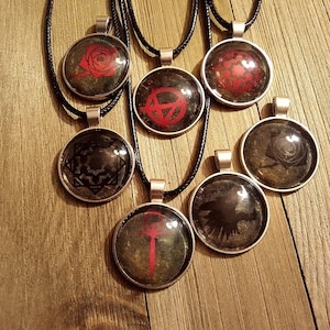 Custom Shadowy Vampire: the Masquerade pendants and keychains