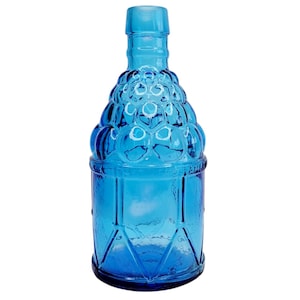 May include: A vintage-style, turquoise blue glass bottle. The bottle features a textured, bubble-like design on the upper portion and a geometric pattern on the lower part. The bottle has a long neck and a flat base, suitable for decorative use.