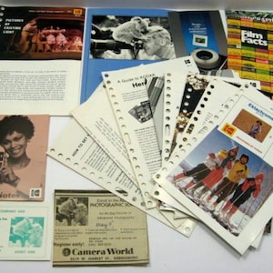 May include: A collection of vintage Kodak photography guides, brochures, and pamphlets. The items include "Candid Notes", "Film Facts", and "Ektachrome" guides. The materials feature images of people, cameras, and skiing. The items are on a white surface.