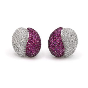 May include: A pair of earrings with a half-circle of white diamonds and a half-circle of pink sapphires.