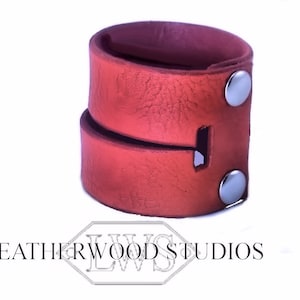 Bracelet that Converts into Bondage Cuffs in Orange Leather to restrain submissive or slaves wrists