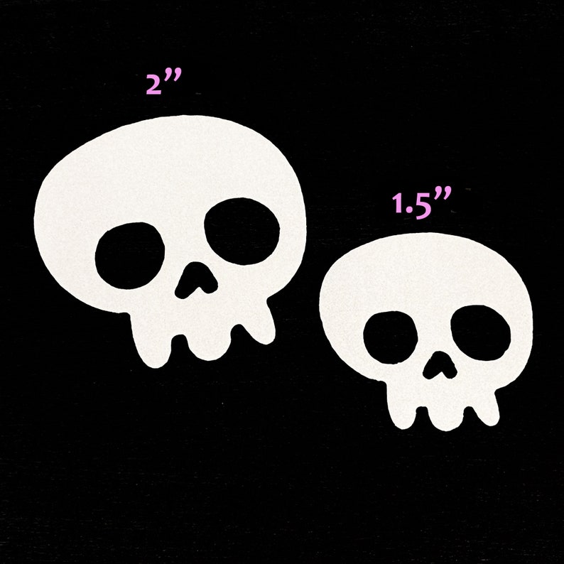 May include: Two white skull stickers, one measuring 2 inches and the other 1.5 inches.