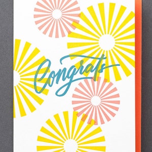 Tarjeta de felicitación con caligrafía tipográfica "Felicitaciones Starburst"
